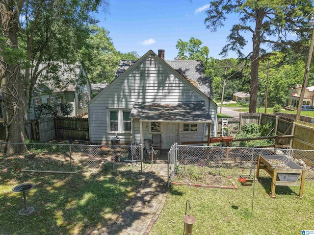784 80th St, Birmingham, AL 35206 - rear view of house with a chimney and a garden