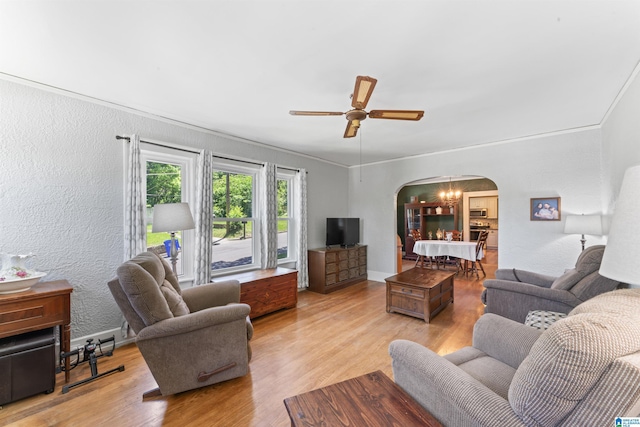 784 80th St, Birmingham, AL 35206 - living area featuring arched walkways, light wood-type flooring, ceiling fan, a textured wall, and baseboards