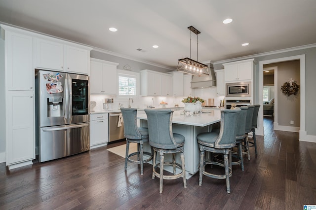 2021 Kinzel Ln, Birmingham, AL 35242 - kitchen featuring appliances with stainless steel finishes, crown molding, custom exhaust hood, white cabinetry, and light countertops
