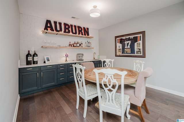 2021 Kinzel Ln, Birmingham, AL 35242 - dining area featuring wet bar, dark wood-style flooring, and baseboards