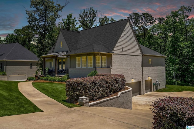 2021 Kinzel Ln, Birmingham, AL 35242 - view of front of home featuring concrete driveway, a lawn, a garage, brick siding, and roof with shingles