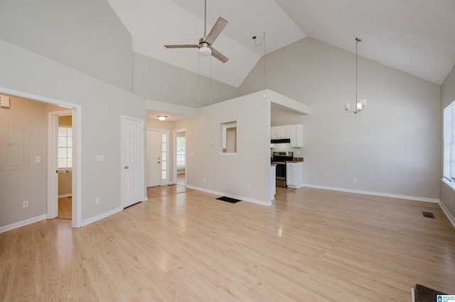 1012 Hickory St, Moody, AL 35004 - unfurnished living room featuring light wood-style flooring, ceiling fan, a chandelier, high vaulted ceiling, and baseboards