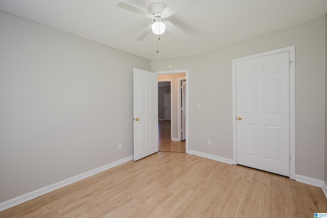 1012 Hickory St, Moody, AL 35004 - unfurnished bedroom featuring light wood-style floors, baseboards, and a ceiling fan