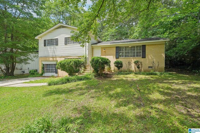 1716 Nancy Ln, Center Point, AL 35215 - split level home with brick siding, a front lawn, and crawl space