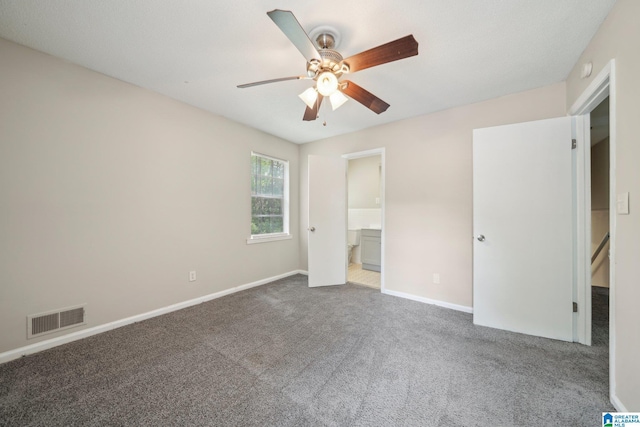 1716 Nancy Ln, Center Point, AL 35215 - unfurnished bedroom featuring carpet flooring, baseboards, a ceiling fan, and connected bathroom