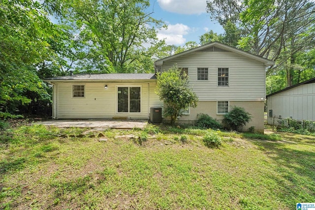 1716 Nancy Ln, Center Point, AL 35215 - back of house featuring central AC unit, a yard, and a patio area