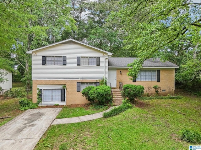 1716 Nancy Ln, Center Point, AL 35215 - tri-level home featuring brick siding, a front yard, driveway, a shingled roof, and crawl space