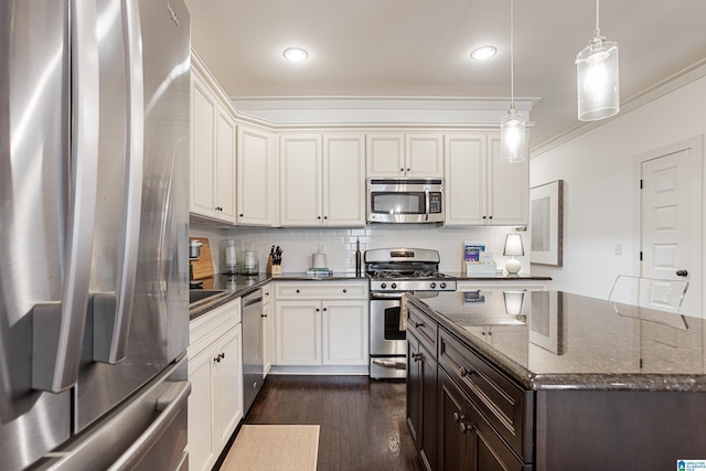 1517 Laurens St, Birmingham, AL 35242 - kitchen featuring stainless steel appliances, dark wood-type flooring, crown molding, dark stone countertops, and tasteful backsplash