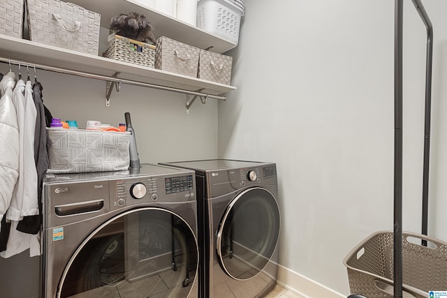 1517 Laurens St, Birmingham, AL 35242 - laundry room featuring washer and dryer, baseboards, and tile patterned floors