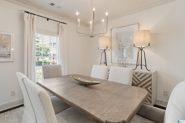 1517 Laurens St, Birmingham, AL 35242 - dining room with baseboards, a chandelier, and crown molding