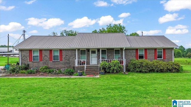 2523 County Road 222, Cullman, AL 35057 - single story home with brick siding, covered porch, and a front yard