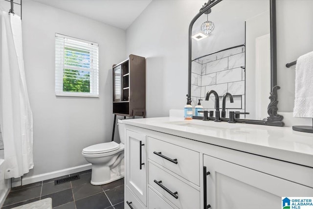 2523 County Road 222, Cullman, AL 35057 - full bathroom featuring vanity, toilet, tile patterned flooring, shower / bathtub combination with curtain, and baseboards