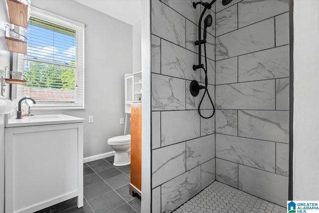 2523 County Road 222, Cullman, AL 35057 - full bath featuring toilet, tiled shower, vanity, and tile patterned flooring