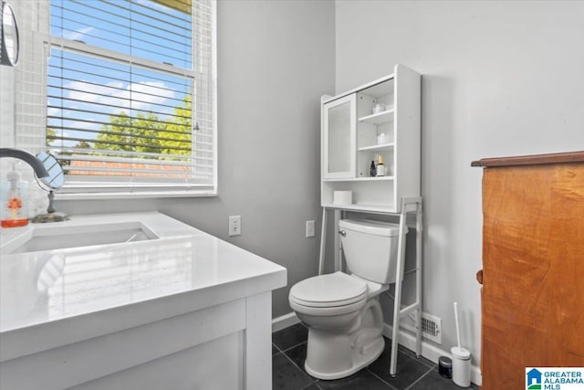 2523 County Road 222, Cullman, AL 35057 - bathroom with tile patterned floors, toilet, vanity, and baseboards