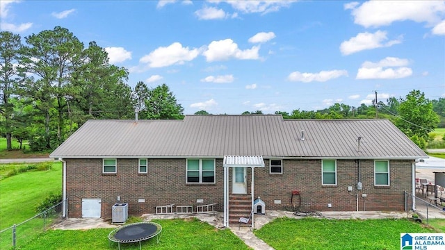 2523 County Road 222, Cullman, AL 35057 - back of house with entry steps, metal roof, brick siding, central AC unit, and a patio area