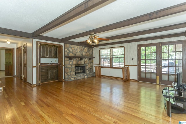 3300 Shetland Trce, Birmingham, AL 35242 - unfurnished living room with a ceiling fan, french doors, wood finished floors, a sink, and beam ceiling