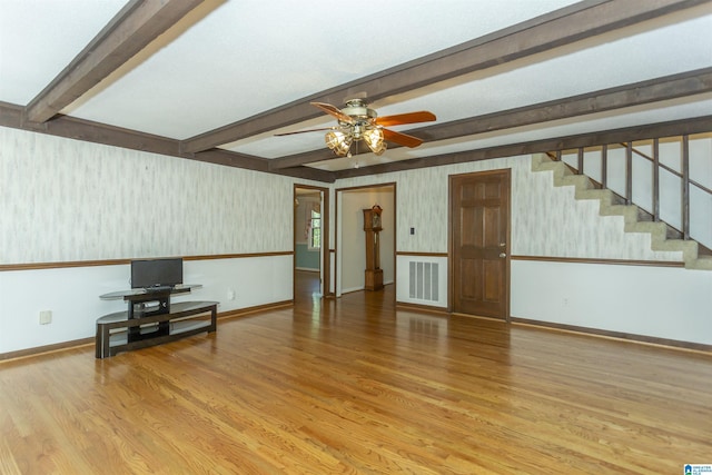 3300 Shetland Trce, Birmingham, AL 35242 - unfurnished living room featuring wallpapered walls, baseboards, wood finished floors, beamed ceiling, and a ceiling fan
