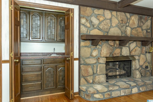 3300 Shetland Trce, Birmingham, AL 35242 - indoor wet bar featuring wood finished floors and a stone fireplace