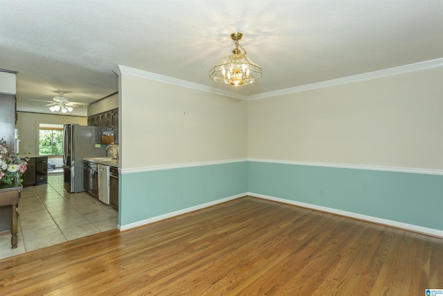 3300 Shetland Trce, Birmingham, AL 35242 - unfurnished room with a chandelier, a ceiling fan, crown molding, light wood-type flooring, and baseboards