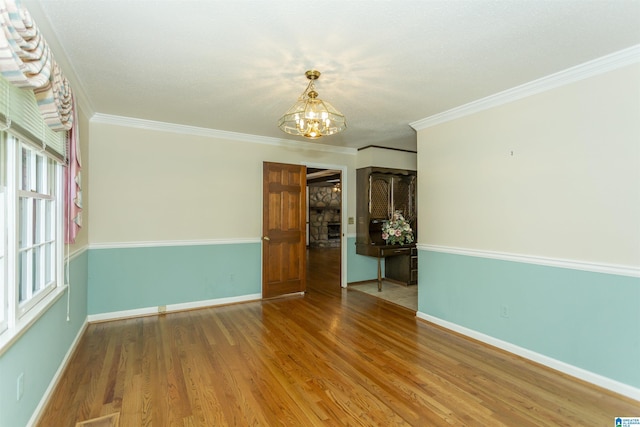 3300 Shetland Trce, Birmingham, AL 35242 - empty room featuring a chandelier, wood finished floors, baseboards, and crown molding