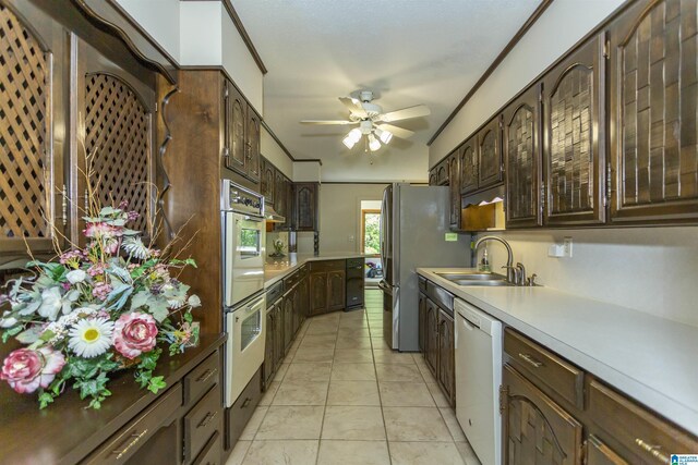 3300 Shetland Trce, Birmingham, AL 35242 - kitchen featuring a sink, white appliances, a ceiling fan, dark brown cabinets, and light countertops