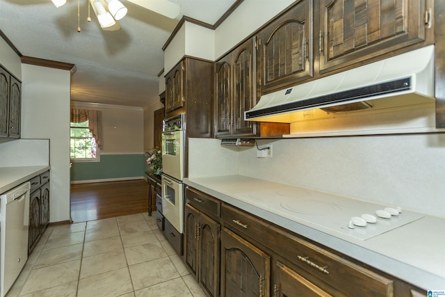 3300 Shetland Trce, Birmingham, AL 35242 - kitchen with under cabinet range hood, ornamental molding, white electric stovetop, dishwashing machine, and dark brown cabinets