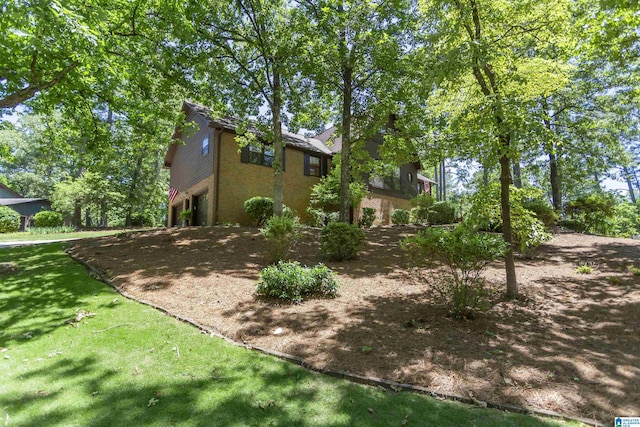 3300 Shetland Trce, Birmingham, AL 35242 - view of home's exterior with an attached garage and a lawn