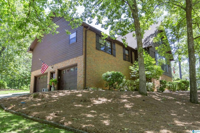 3300 Shetland Trce, Birmingham, AL 35242 - view of property exterior featuring a garage, brick siding, and driveway