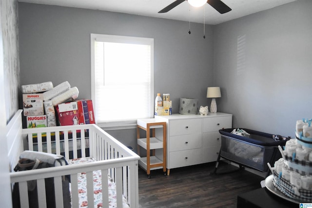 1508 Cloverdale Rd, Anniston, AL 36207 - bedroom featuring multiple windows, dark wood-style floors, and a nursery area