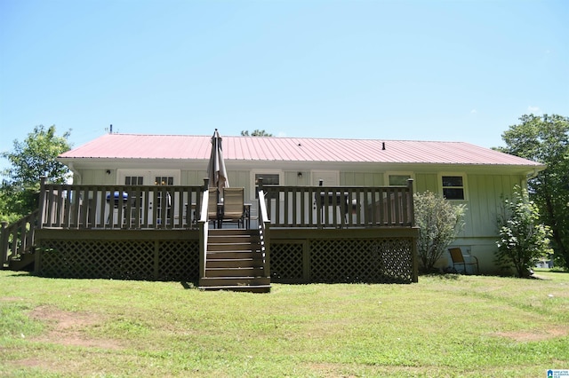 1508 Cloverdale Rd, Anniston, AL 36207 - back of house with stairs, a lawn, board and batten siding, a wooden deck, and metal roof
