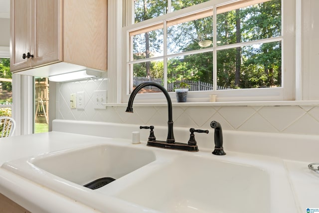 1709 Wakefield Dr, Hoover, AL 35216 - kitchen view of a sink, light countertops, and tasteful backsplash
