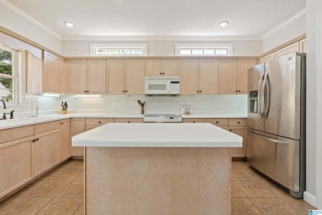 1709 Wakefield Dr, Hoover, AL 35216 - kitchen featuring stainless steel fridge, light brown cabinets, white microwave, a sink, and light tile patterned floors