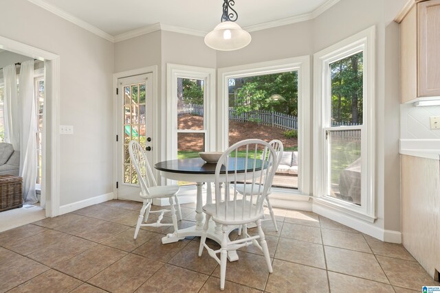 1709 Wakefield Dr, Hoover, AL 35216 - dining room with plenty of natural light, ornamental molding, light tile patterned flooring, and baseboards