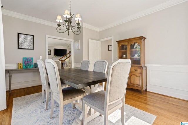 1709 Wakefield Dr, Hoover, AL 35216 - dining room with ornamental molding, a chandelier, light wood-type flooring, and wainscoting