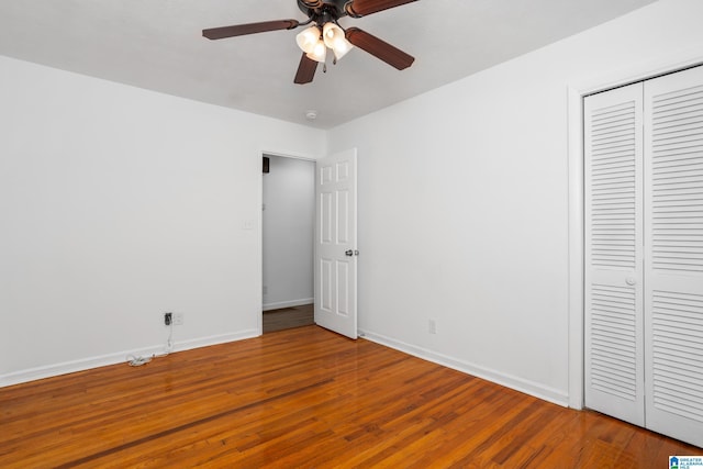 1826 Edwardian Way, Anniston, AL 36207 - unfurnished bedroom featuring wood finished floors, a closet, baseboards, and ceiling fan