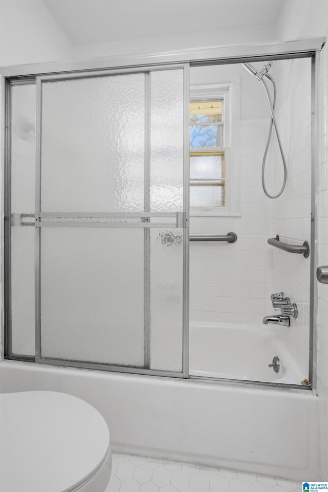 1826 Edwardian Way, Anniston, AL 36207 - bathroom featuring toilet, enclosed tub / shower combo, and tile patterned flooring