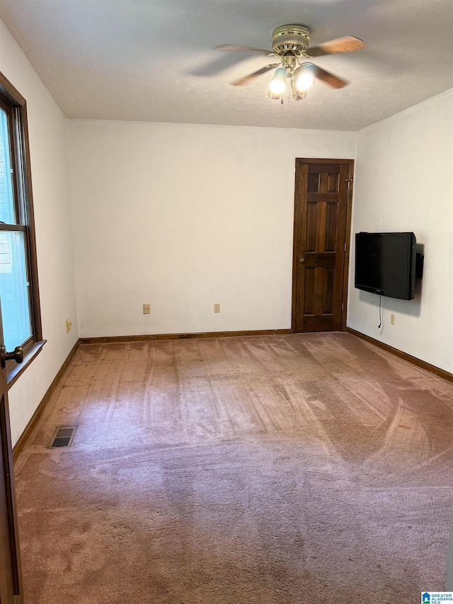 2301 Hathaway Heights Rd, Anniston, AL 36207 - carpeted empty room with ceiling fan and baseboards