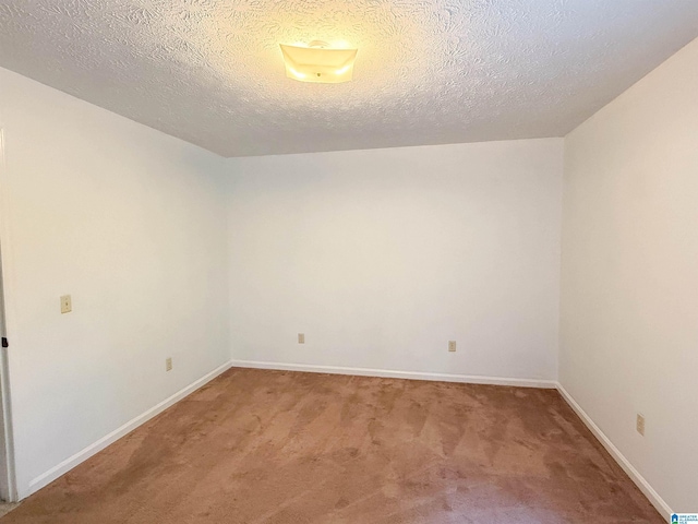 2301 Hathaway Heights Rd, Anniston, AL 36207 - empty room with light colored carpet, baseboards, and a textured ceiling