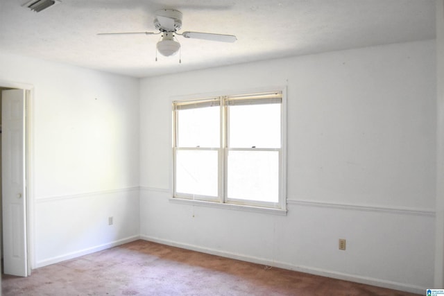 2301 Hathaway Heights Rd, Anniston, AL 36207 - unfurnished bedroom with light colored carpet, baseboards, and ceiling fan