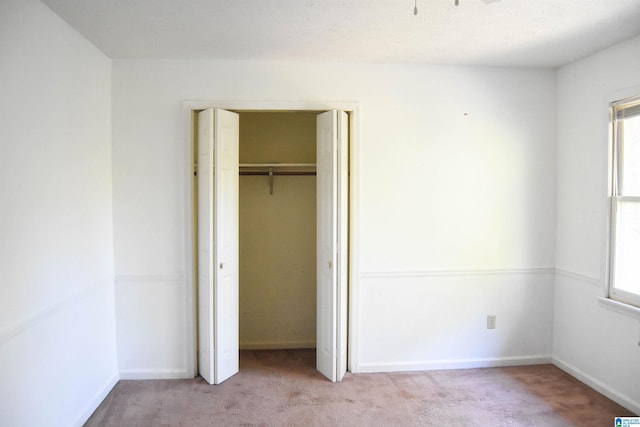 2301 Hathaway Heights Rd, Anniston, AL 36207 - unfurnished bedroom with carpet flooring, a closet, and baseboards