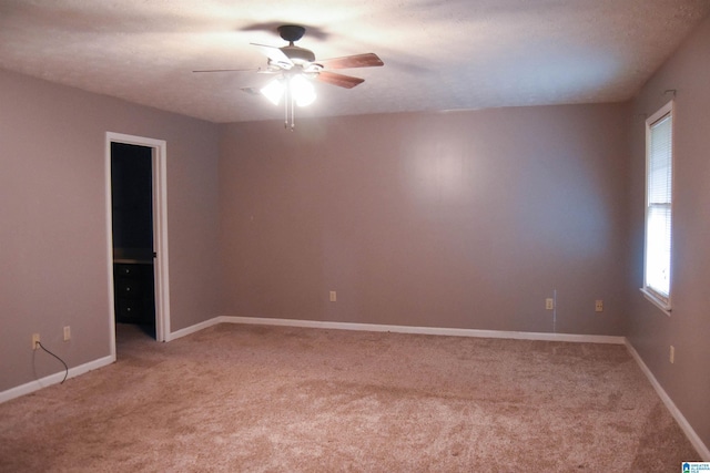 2301 Hathaway Heights Rd, Anniston, AL 36207 - spare room featuring ceiling fan, light carpet, and baseboards
