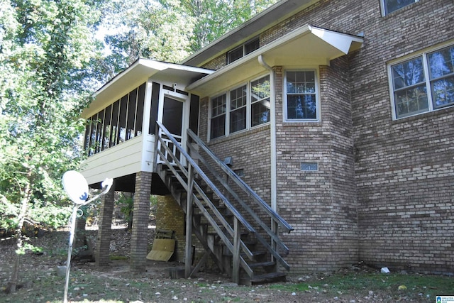 2301 Hathaway Heights Rd, Anniston, AL 36207 - view of property exterior with a sunroom, stairs, and brick siding