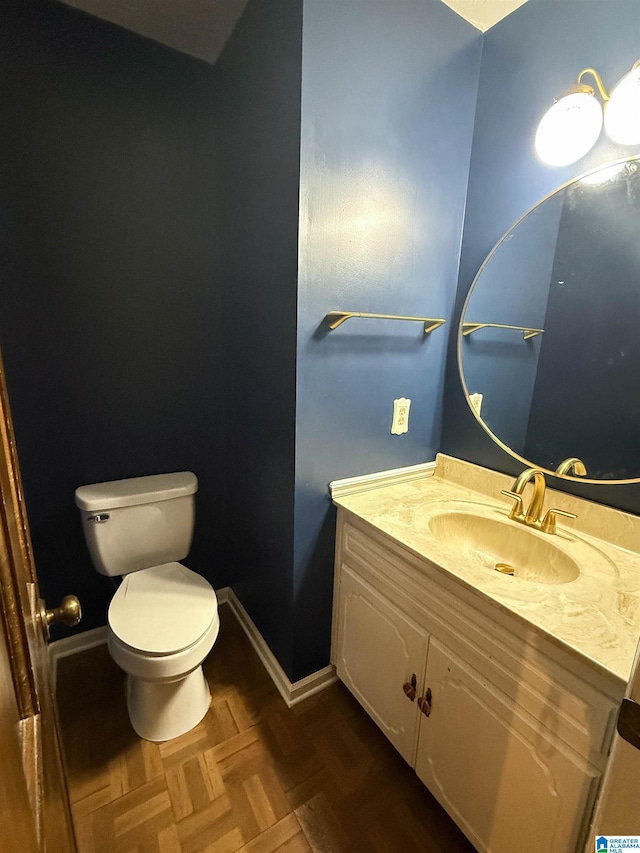2301 Hathaway Heights Rd, Anniston, AL 36207 - bathroom featuring toilet, vanity, and baseboards