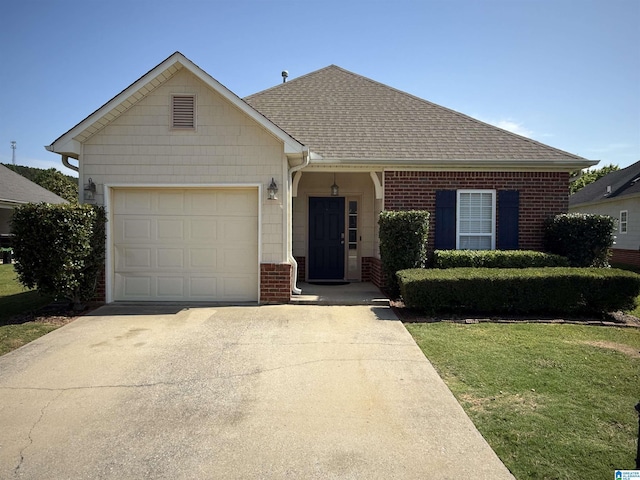 1009 Fairbank Ln, Chelsea, AL 35043 - view of front of property featuring concrete driveway, a garage, brick siding, a shingled roof, and a front yard