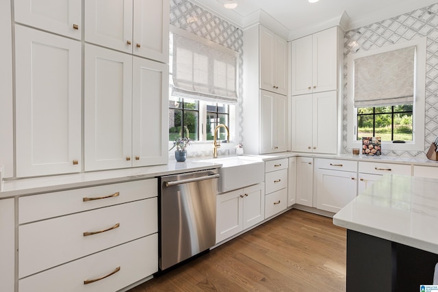 3 Troon, Birmingham, AL 35242 - kitchen featuring stainless steel dishwasher, a sink, white cabinets, light wood-style floors, and light stone counters