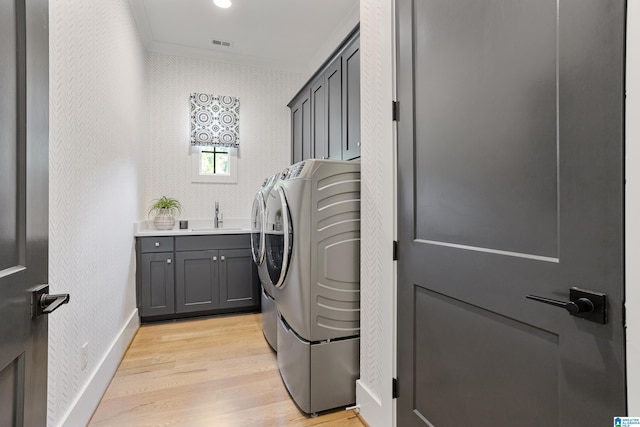 3 Troon, Birmingham, AL 35242 - laundry area with washing machine and clothes dryer, light wood-style flooring, cabinet space, baseboards, and ornamental molding