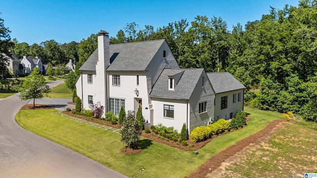 3 Troon, Birmingham, AL 35242 - view of side of property featuring a chimney, a yard, stucco siding, and a shingled roof