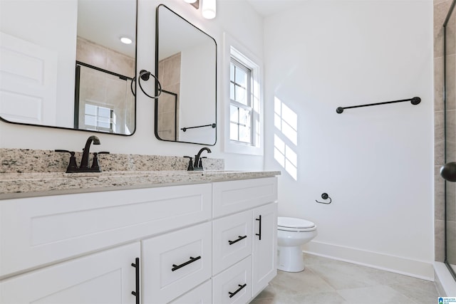 149 Shiloh Creek Dr, Calera, AL 35040 - full bath featuring tiled shower, double vanity, toilet, baseboards, and tile patterned floors