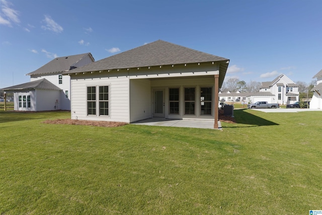 149 Shiloh Creek Dr, Calera, AL 35040 - rear view of property with a shingled roof, a patio area, a yard, and central AC unit