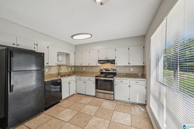 1056 Cardinal Cir, Hueytown, AL 35023 - kitchen featuring black appliances, exhaust hood, decorative backsplash, a sink, and white cabinetry